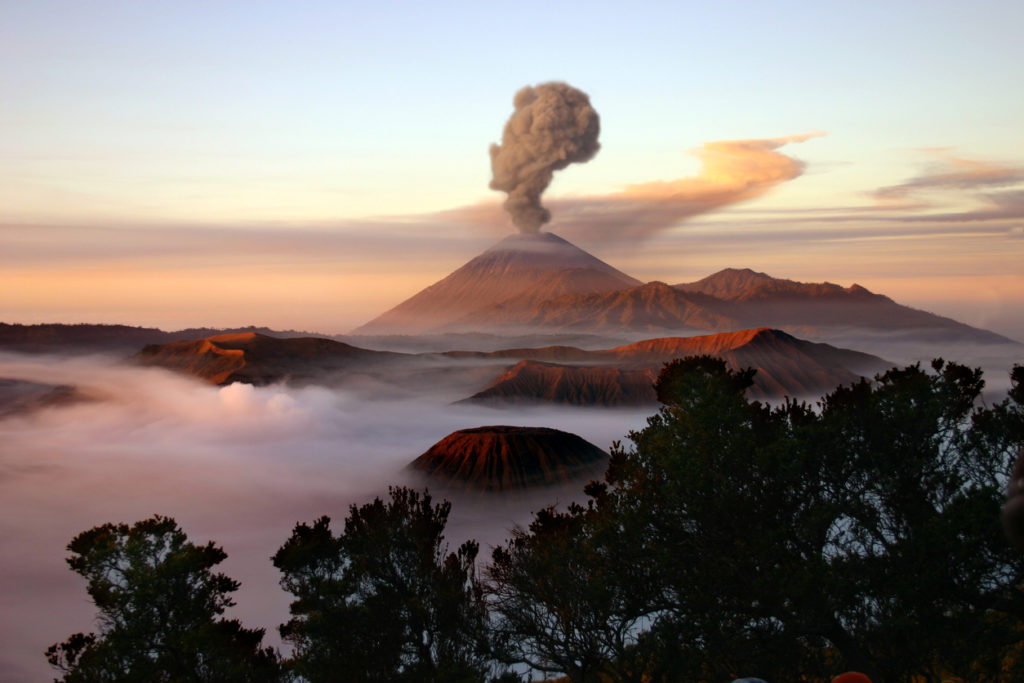 Mount Merapi in Java, Indonesia, with a plume of smoke